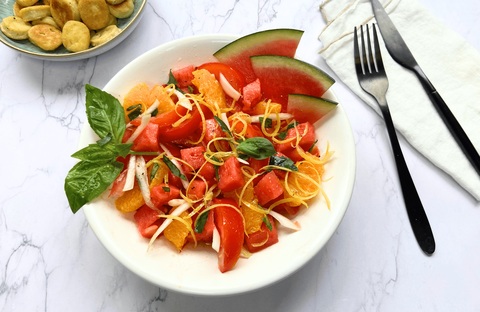 Recette de Salade de tomates, pastèque, orange - Quenelles poêlées